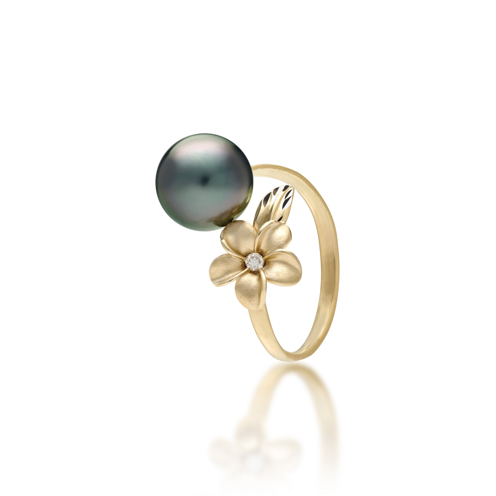 A 14k yellow gold bypass ring featuring a 10-11mm Tahitian black pearl and diamond-accented plumeria with a satin finish and diamond-cut leaf, set against a clean white background with a soft reflection.