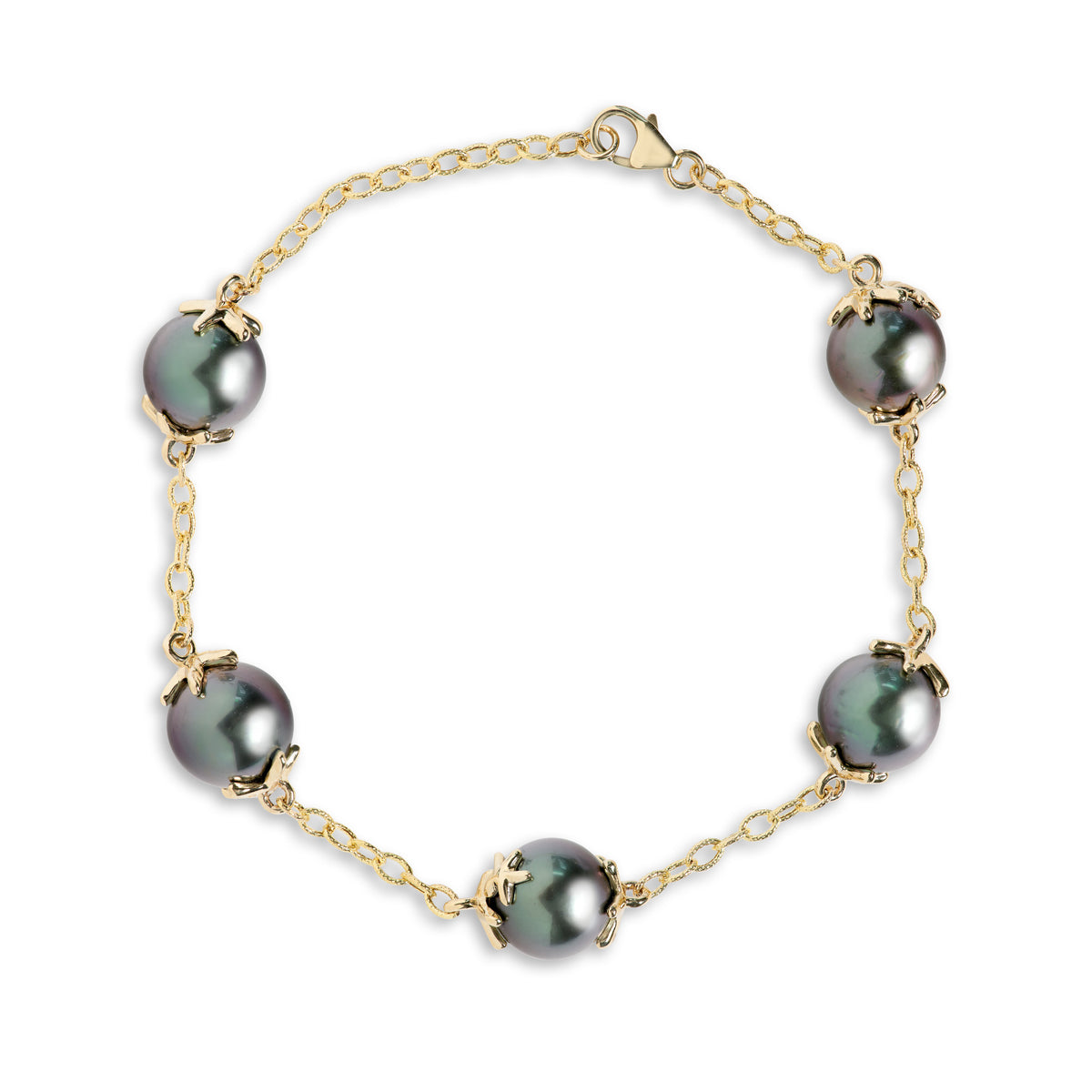 A 14k yellow gold link bracelet with Tahitian black pearls and starfish mounted onto each side of the pearl and a lobster claw clasp, shown on a white background