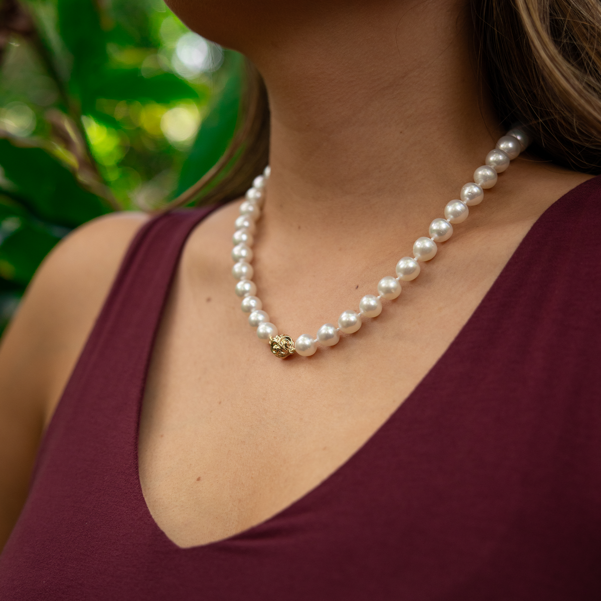 18-19" 9-10mm South Sea White Pearl Strand with Magnetic Clasp in Gold on a woman's neck