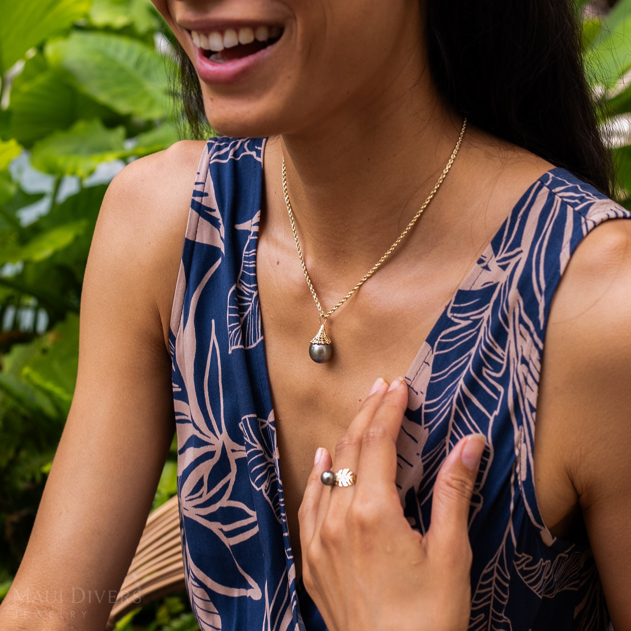Fish Net 14-17mm Tahitian Black Pearl Pendant in Gold on a woman in a garden