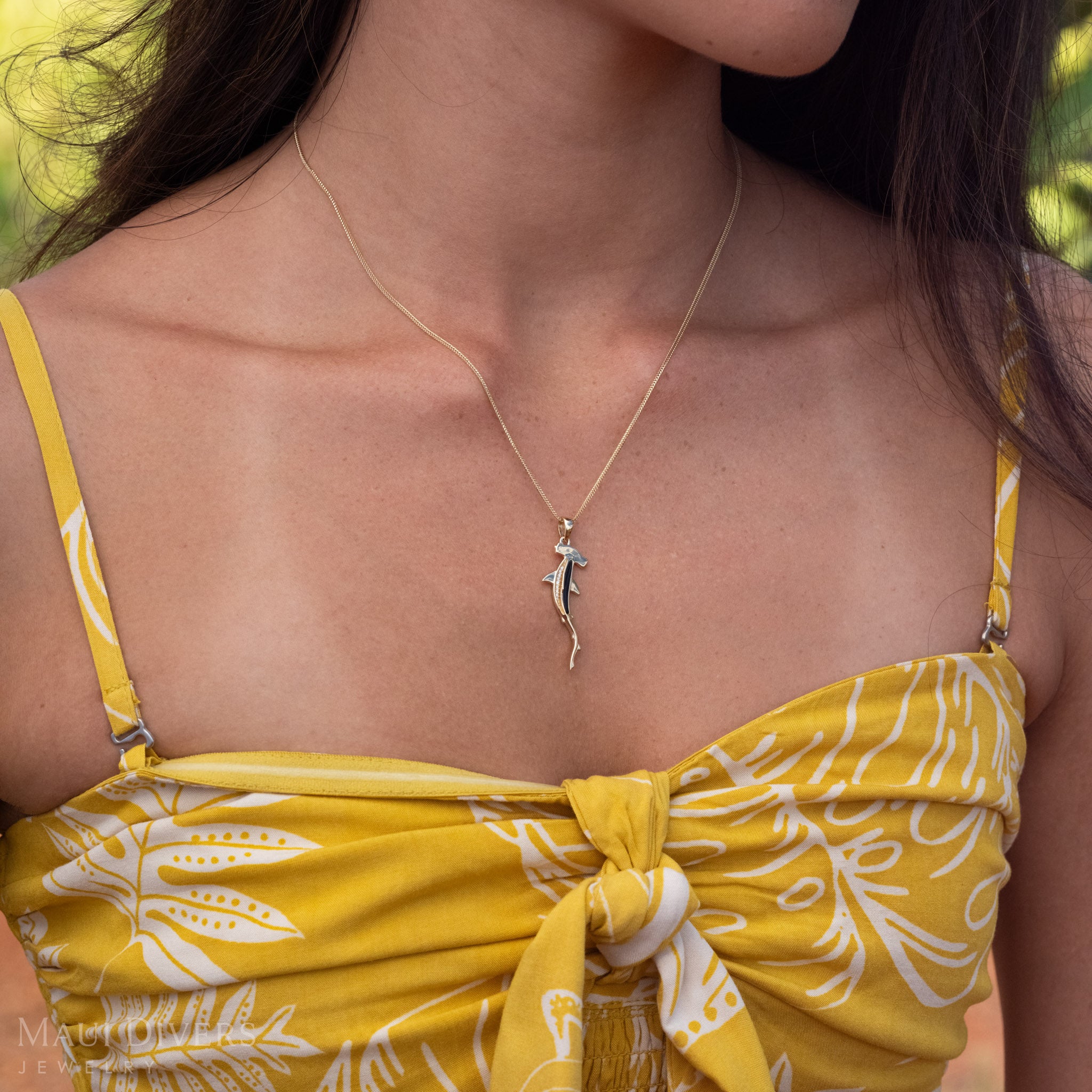 Close-up of 14k Gold Hammerhead Necklace with rare Black Coral and Natural Diamonds.