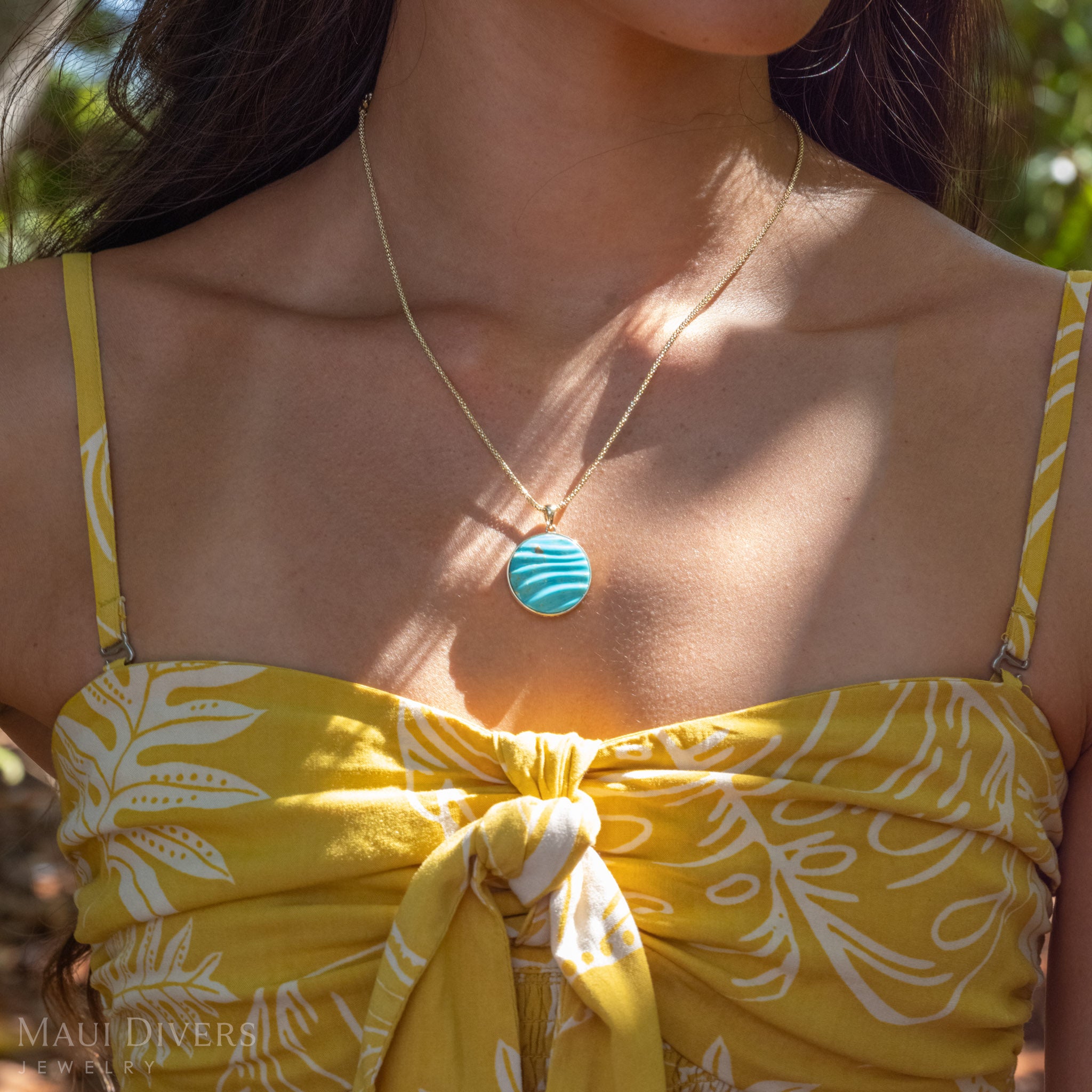 Close-up of Turquoise Ocean Sand Pendant in 14k Gold.
