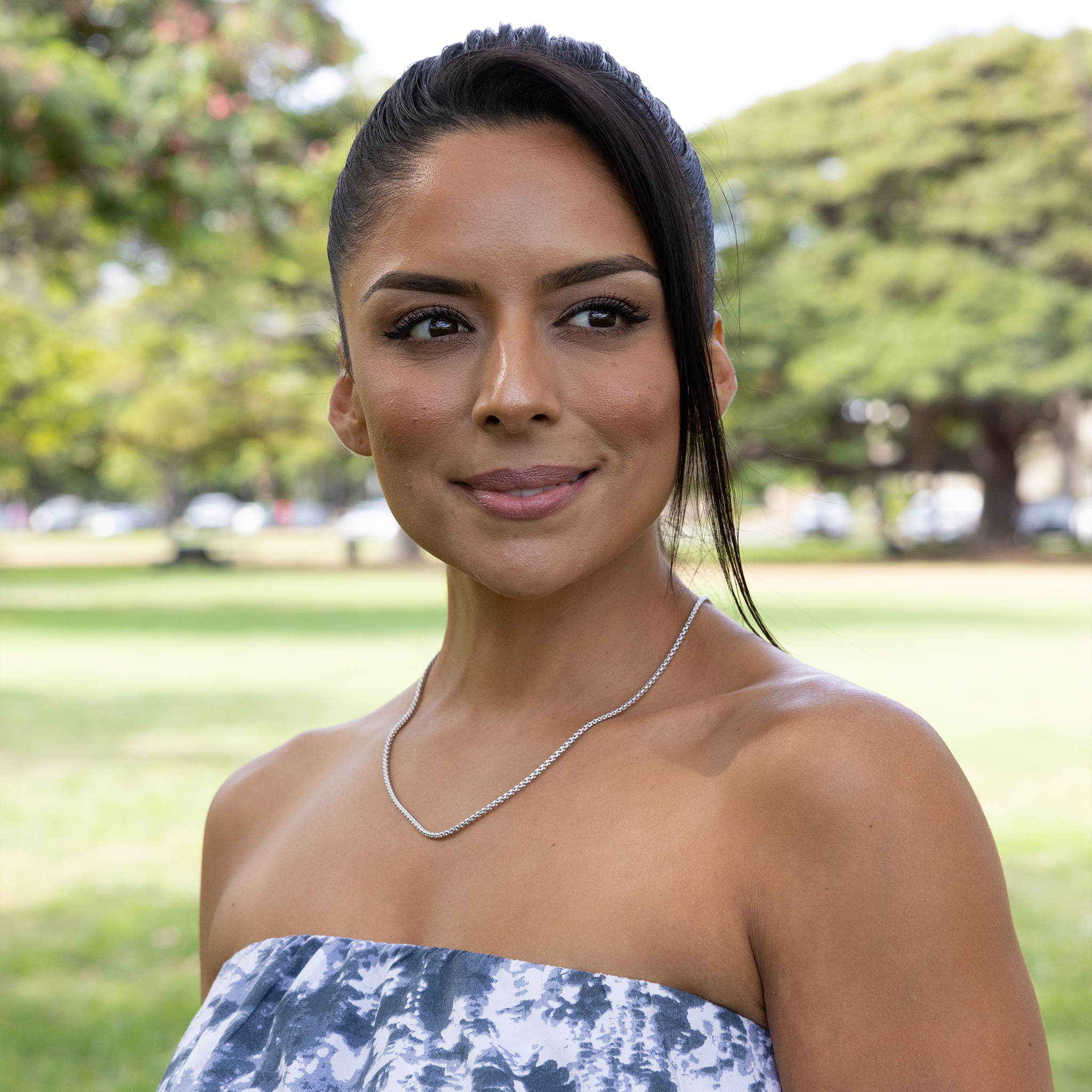 Woman in a park wearing 2.5mm Round Box Chain in Sterling Silver