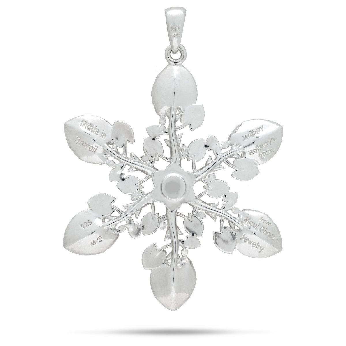 Backside of a sterling silver kalo leaf ornament/pendant in a snowflake style formation showcasing the engravings 'Made in Hawaii', 'Happy Holidays 2026 from Maui Divers Jewelry', and '925' stamp, shown on a white background