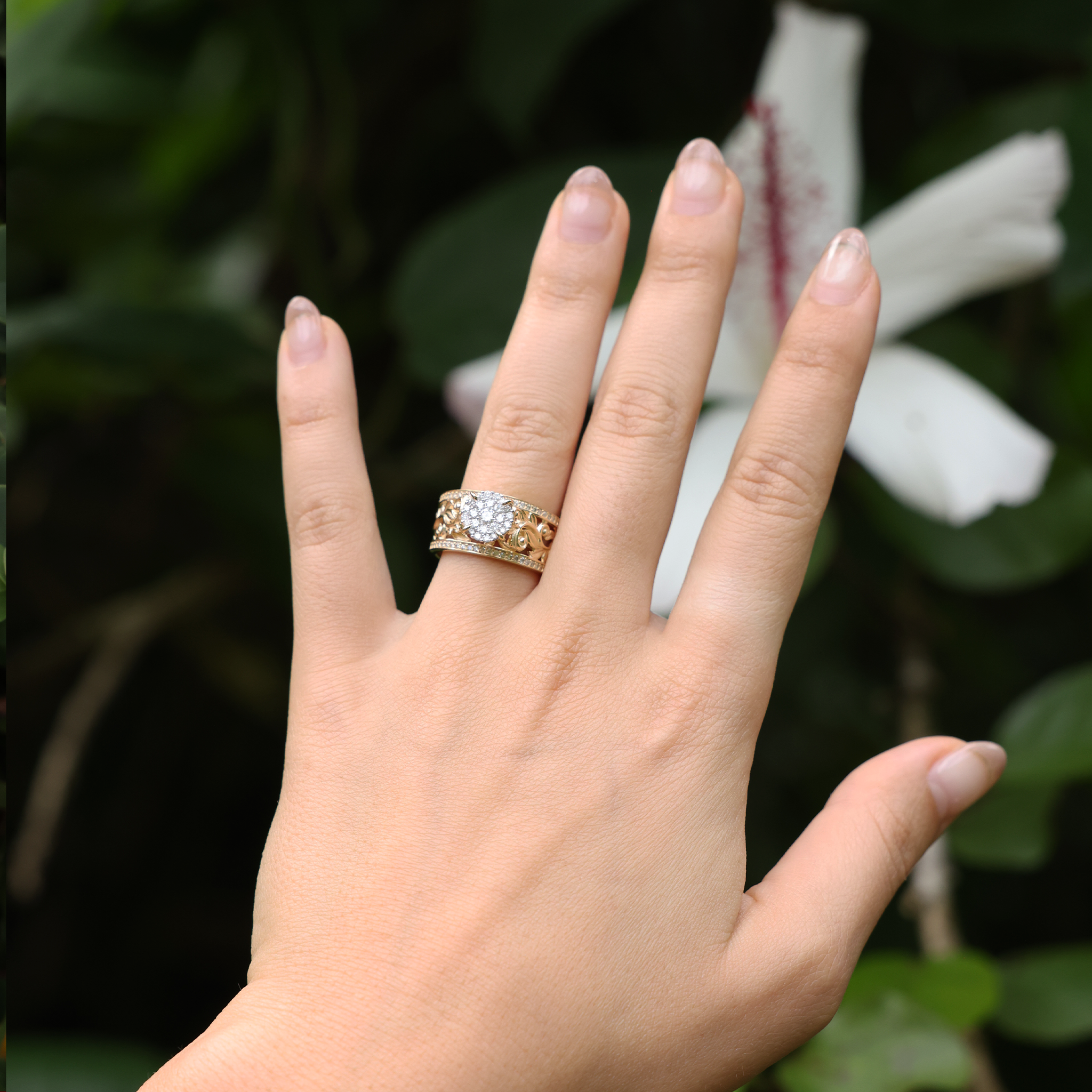 A woman's hand with a Living Heirloom Engagement Ring in Gold with Diamonds - 10mm - Maui Divers Jewelry