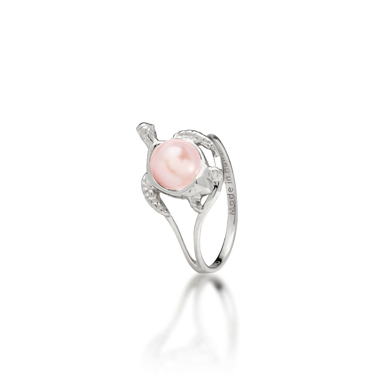 A 14k white gold sea turtle ring with a pink freshwater pearl as its shell, shown on a white background
