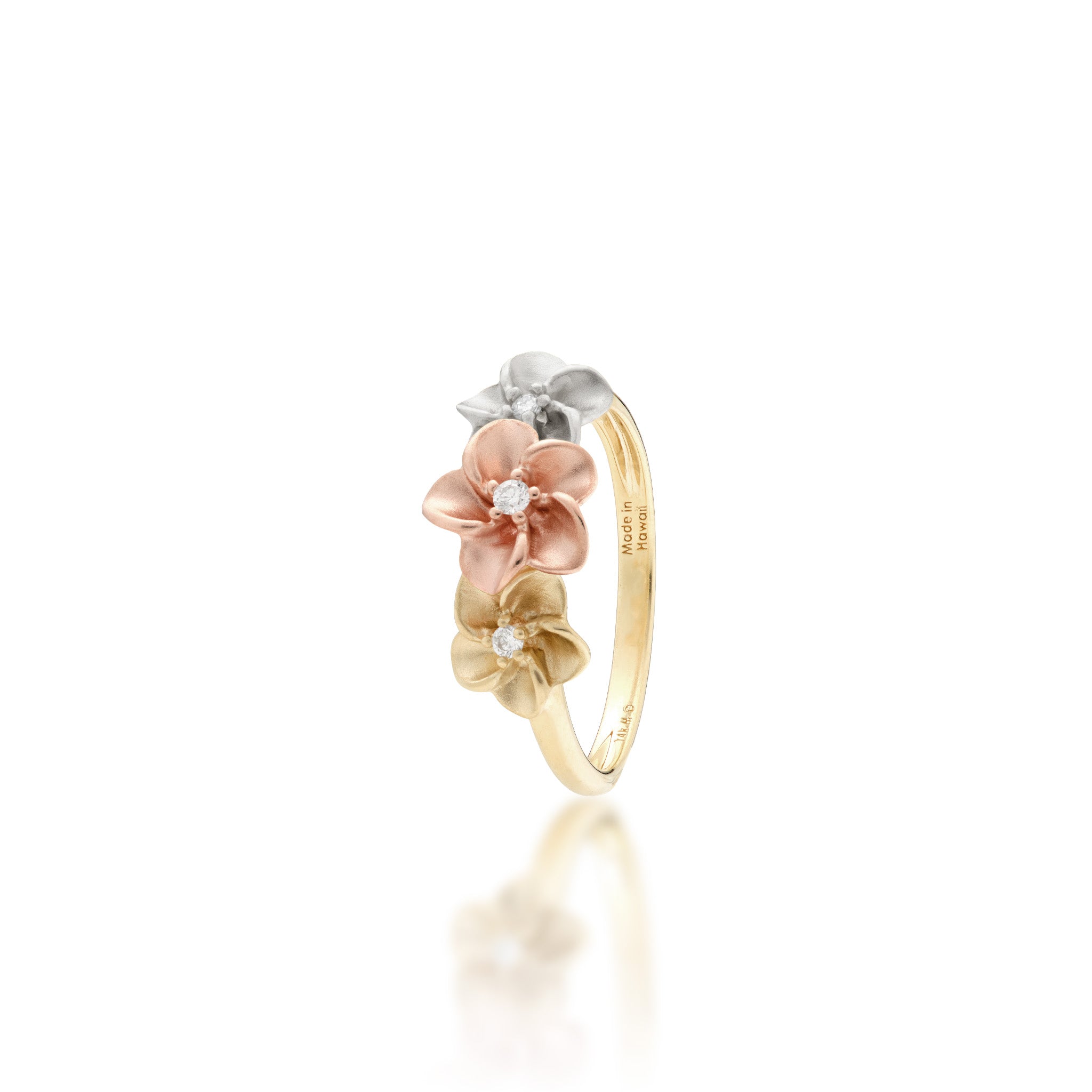 Angle view of the 8mm Three Plumeria Ring in Tri Color Gold with Diamonds on a white background
