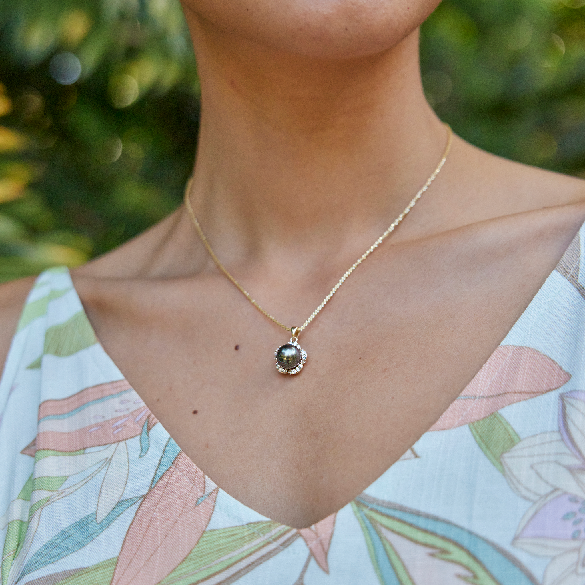 Model Wearing Plumeria Tahitian Black Pearl Pendant in Gold with Diamonds