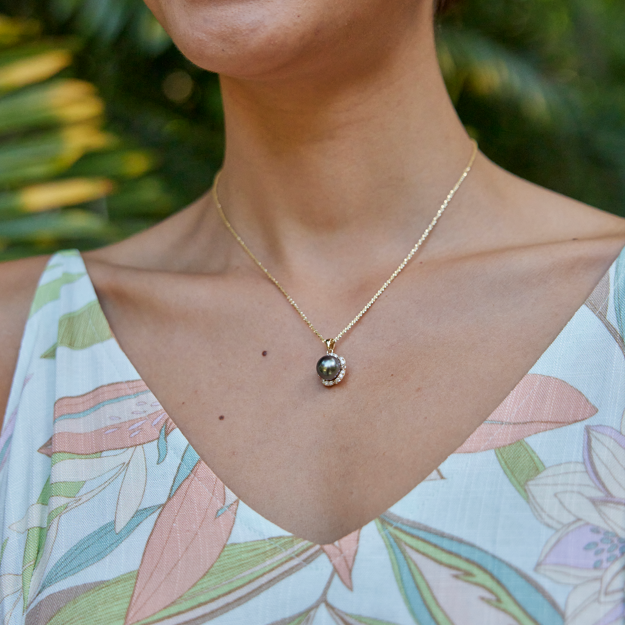 Model Wearing Plumeria Tahitian Black Pearl Pendant in Gold with Diamonds