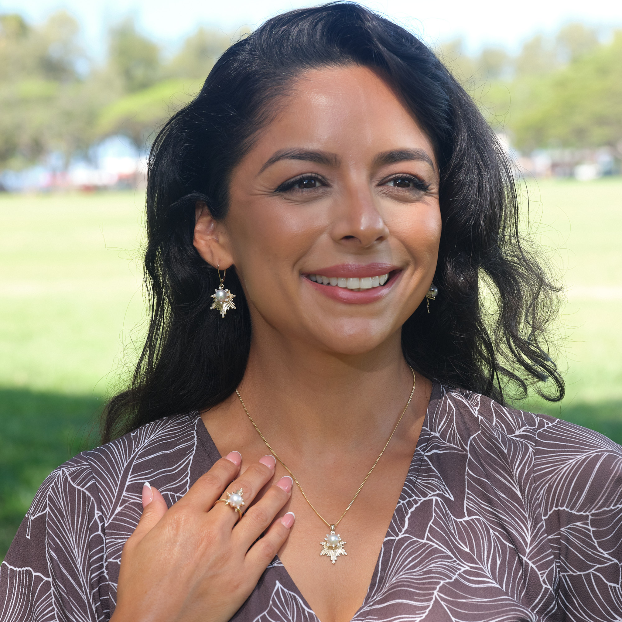 A woman wearing an E Hoʻāla Akoya Pearl earrings in Gold with Diamonds - Maui Divers Jewelry