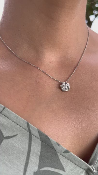 Video of a woman wearing a Hawaiian Gardens Hibiscus Pendant in White Gold with Diamonds - 11mm - Maui Divers Jewelry