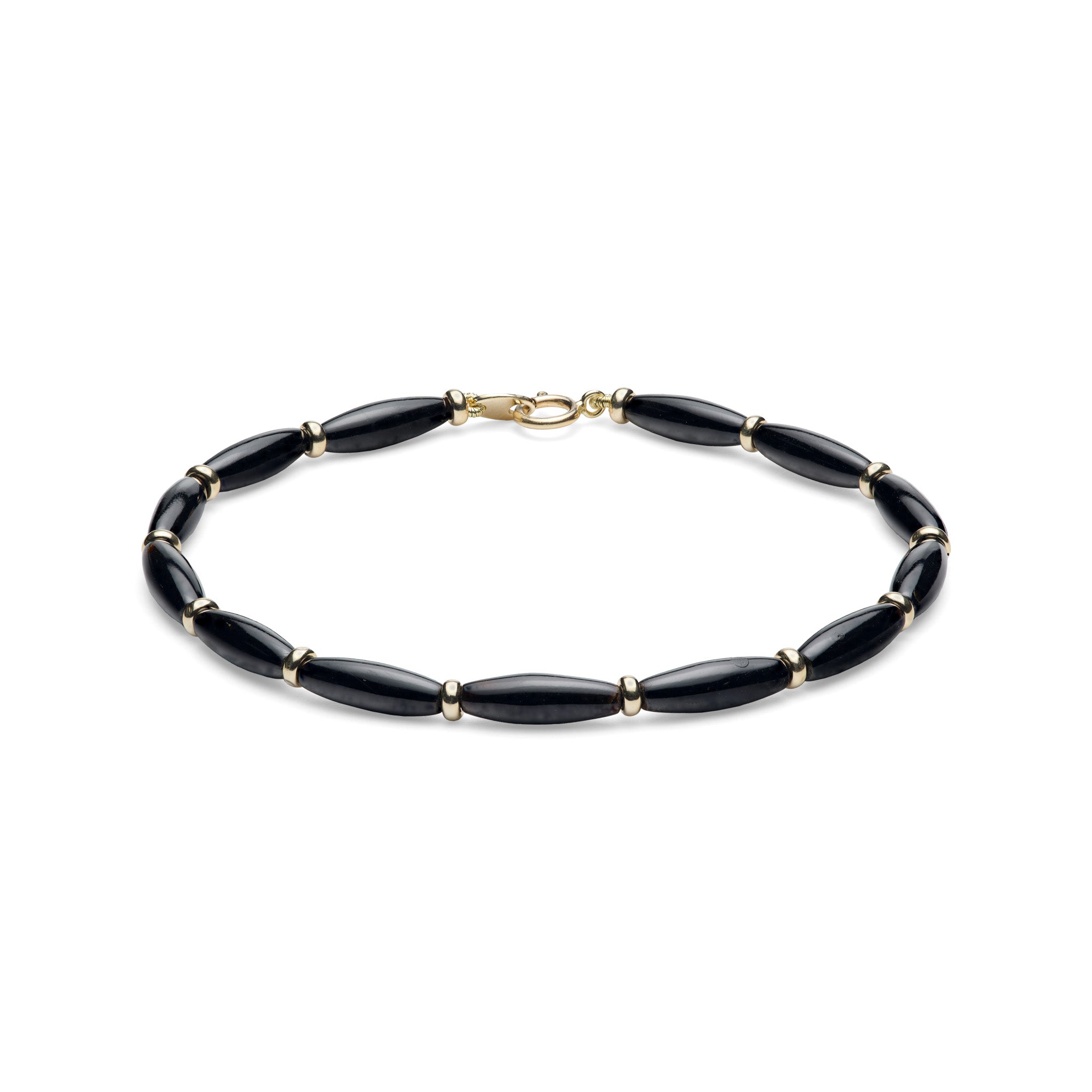 A beaded bracelet featuring glossy Hawaiian black coral oval beads separated by small gold spacer rings, completed with a gold clasp, shown on a plain white background.