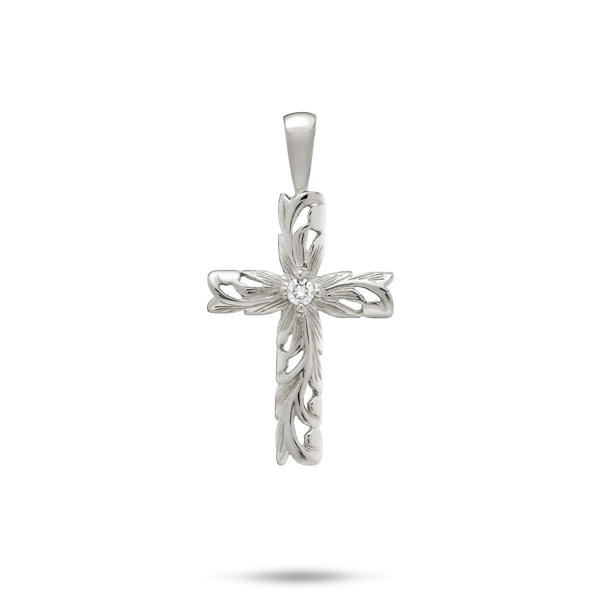 A 14k white gold cross pendant featuring Hawaiian heirloom scrollwork with maile leaves, ferns, and a diamond accent at the center, shown on a white background