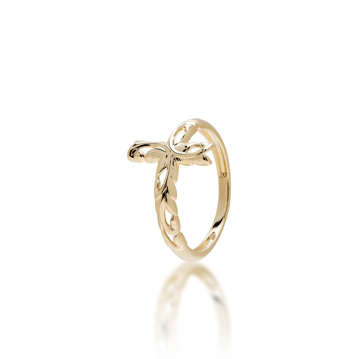 A delicate 14k yellow gold ring featuring a cross design with maile leaf and fern Old-English scrollwork, shown on a clean white background with a soft reflection below.