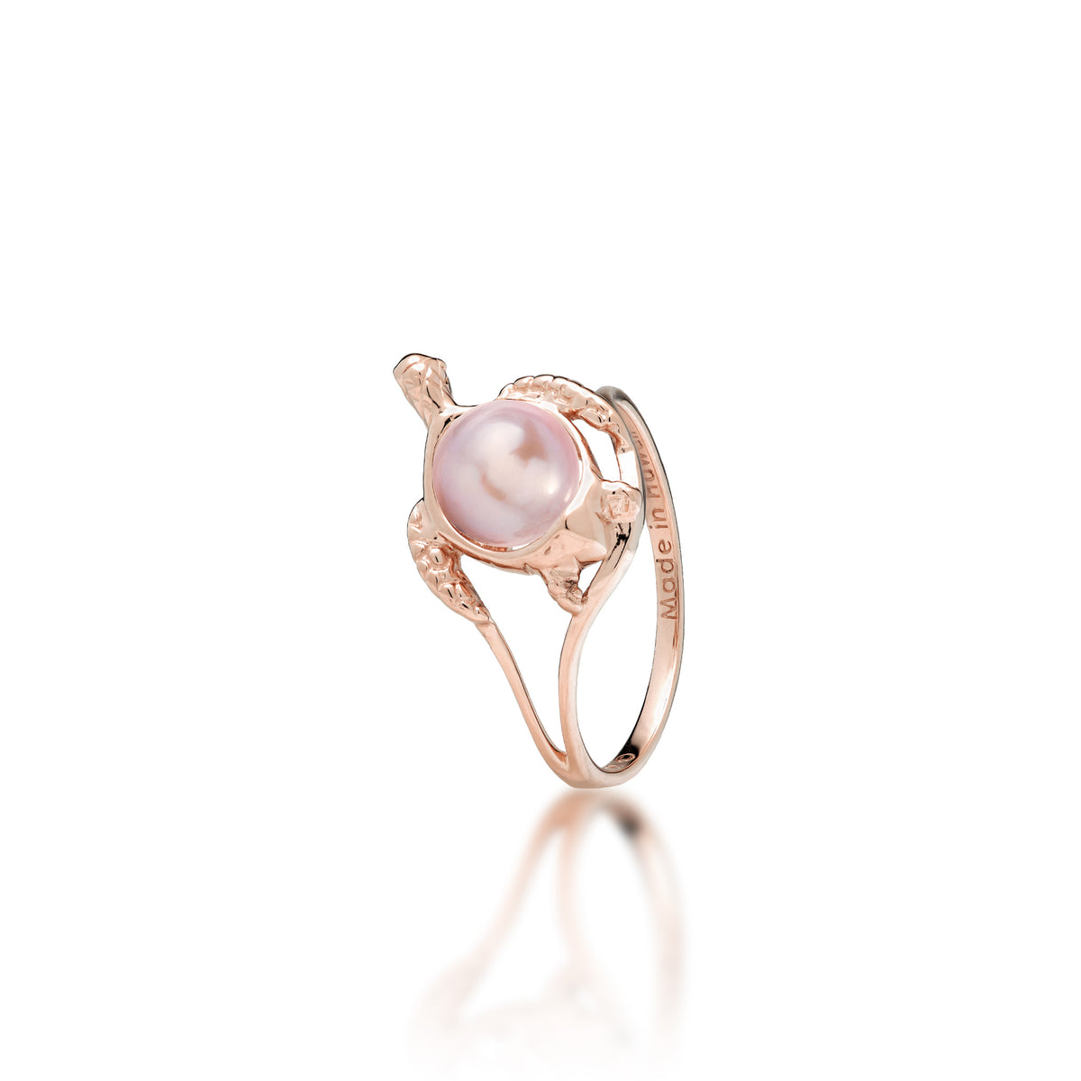 A 14k rose gold sea turtle ring with a lavender freshwater pearl as its shell, shown on a white background