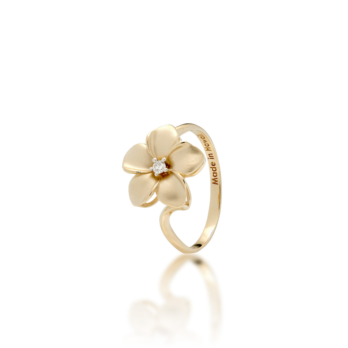 A 14k yellow gold 13mm plumeria flower ring with a diamond accent in the center and satin finished petals with high-polish edges, shown on a white background