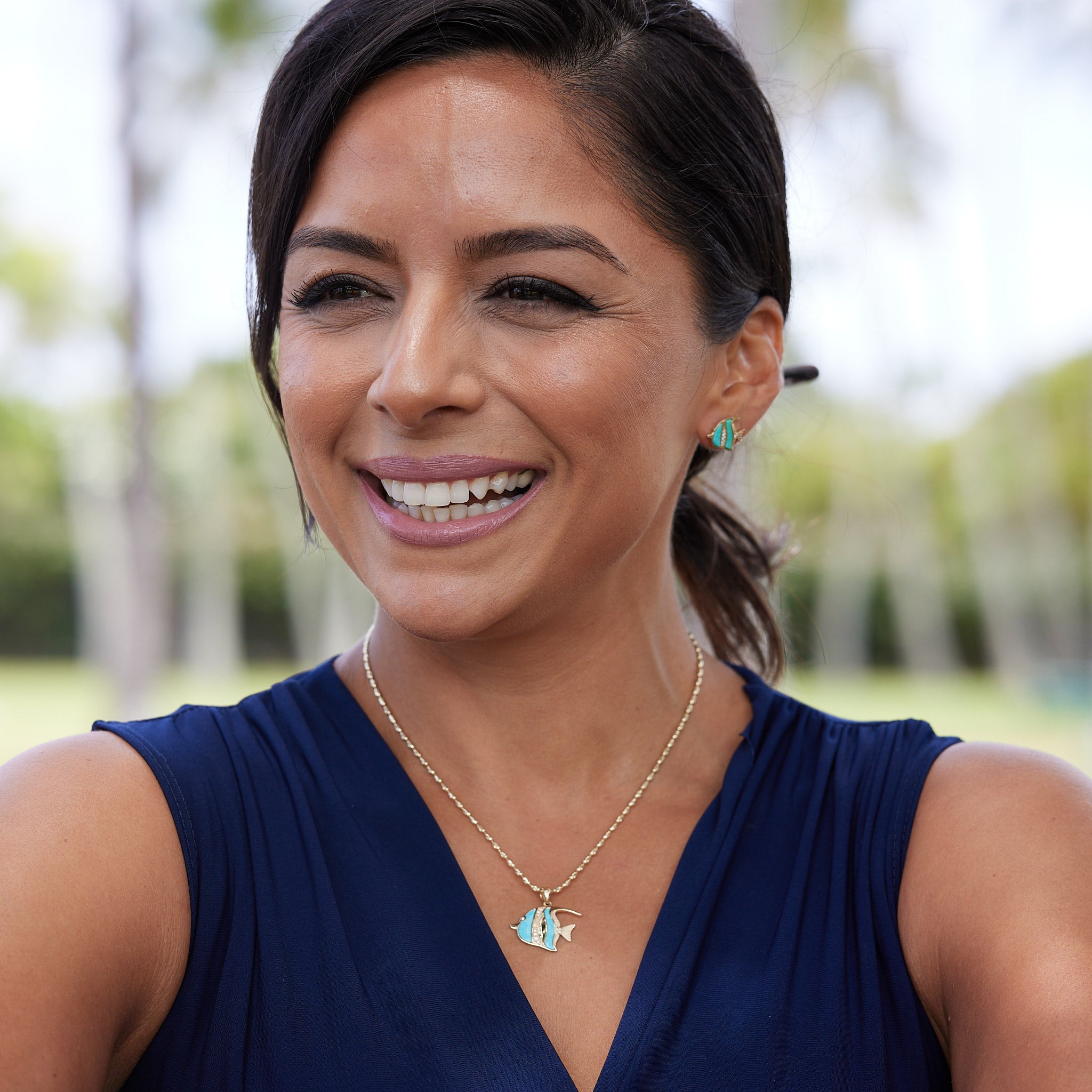 A woman wearing Sealife Angelfish Turquoise Earrings and Pendant  in Gold with Diamonds - Maui Divers Jewelry