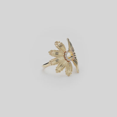 Beach & Mountain Naupaka Ring in Gold with Diamonds on a white turntable