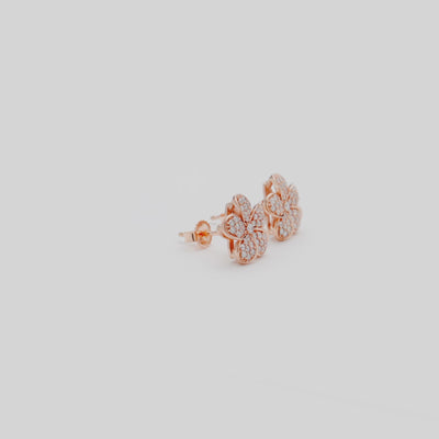 Video showcasing the 11mm Plumeria Earrings in Rose Gold with Diamonds on a turn table