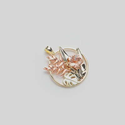 Video of a Hawaiian Gardens Hibiscus Pendant in Tri Color Gold with Diamonds on a white turn table