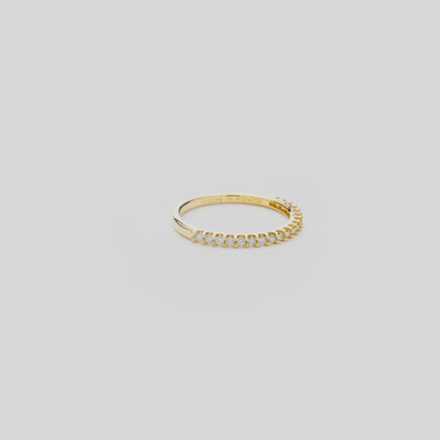 Anniversary Ring in Gold with Diamonds on a white turn table