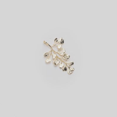 Video of the 36mm ʻIwaʻiwa (Maiden Hair) Fern Pendant in 14k Yellow Gold turning on a white background