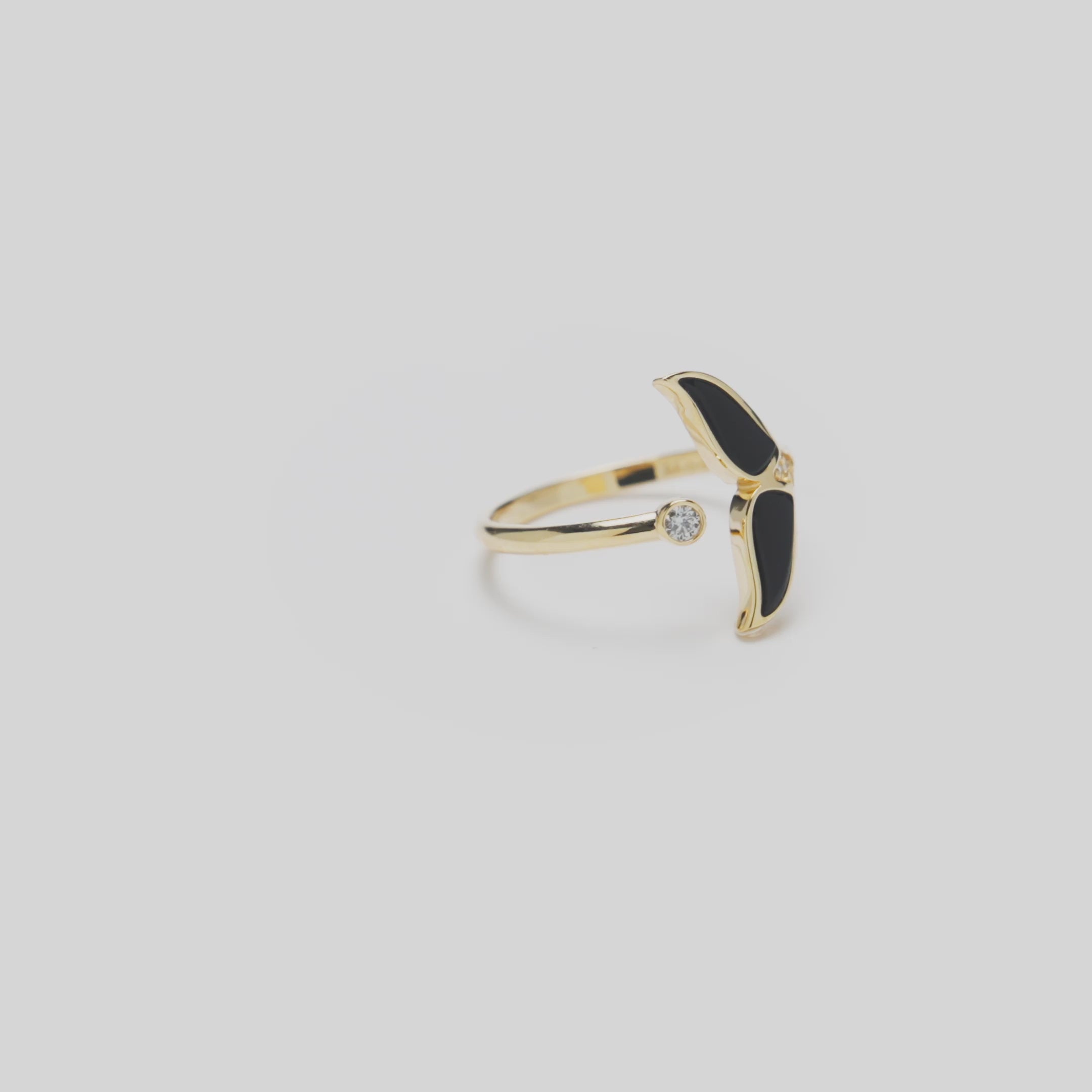 Video of Sealife Whale Tail Black Coral Ring in Gold with Diamonds  on white turn table