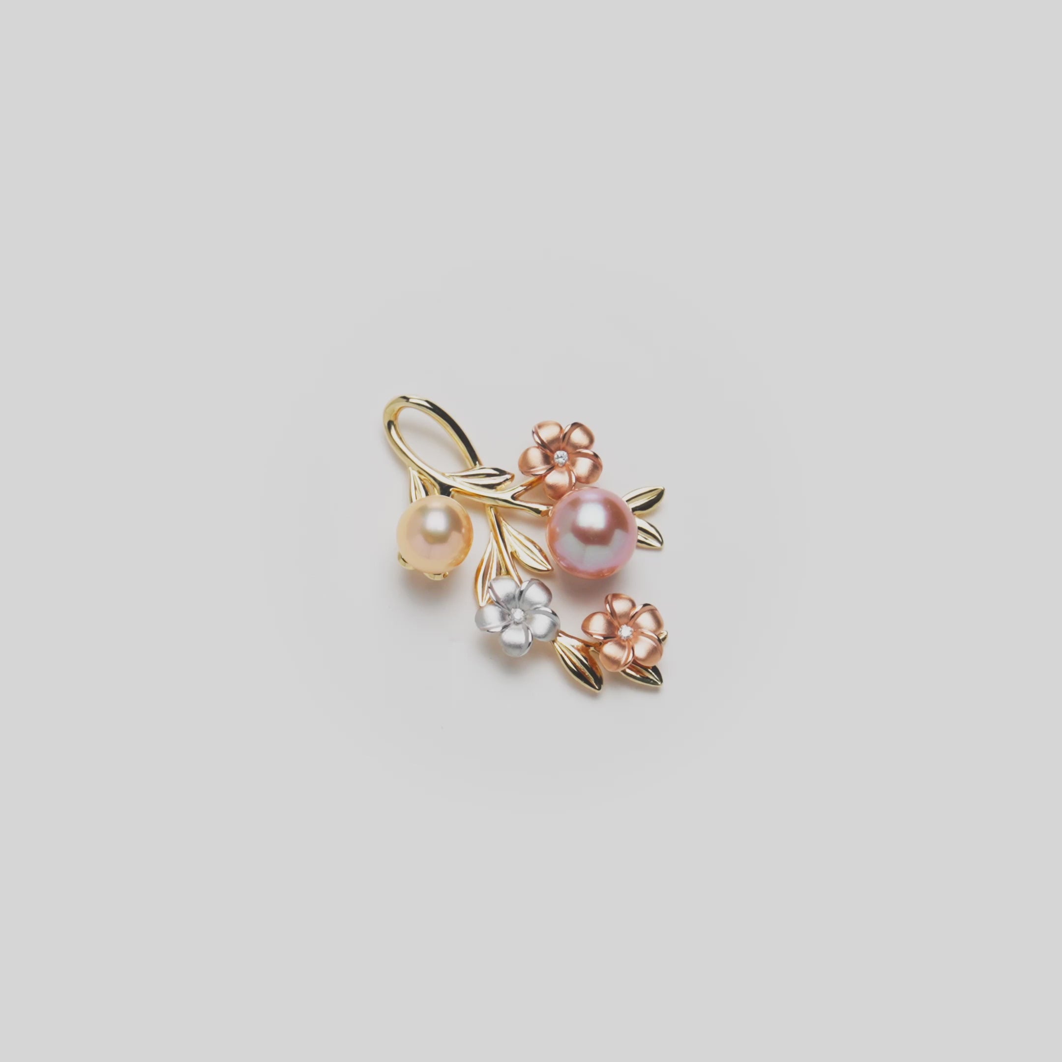 Video of the 36mm Pearls in Bloom Plumeria Lavender Freshwater Pearl Pendant in Tri Color Gold with Diamonds turning on a white background