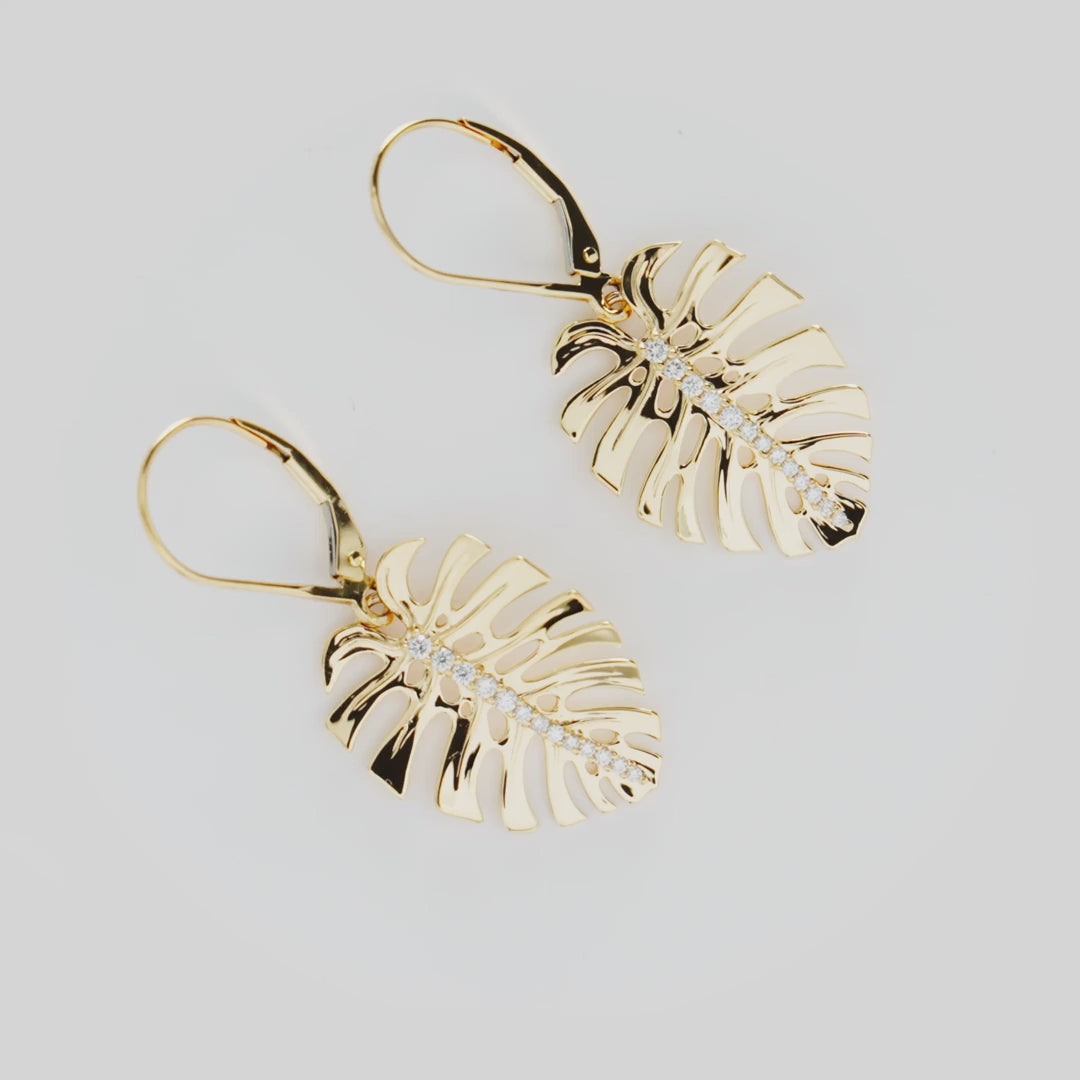 Video showcasing the 23mm Monstera Earrings in 14k Yellow Gold with Diamonds on a turn table