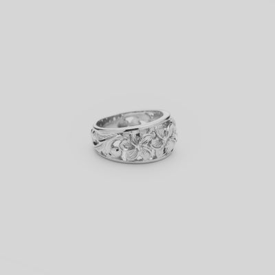 Video of the 11mm Hawaiian Heirloom Plumeria White Sapphire Ring in Sterling Silver turning on a white background