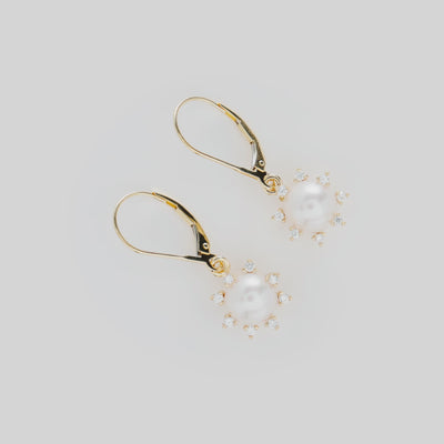 Video showcasing the Protea Akoya White Pearl Earrings in Gold with Diamonds on a turn table