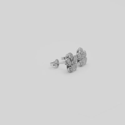 Video showcasing the Plumeria Earrings in White Gold with Diamonds on a turn table