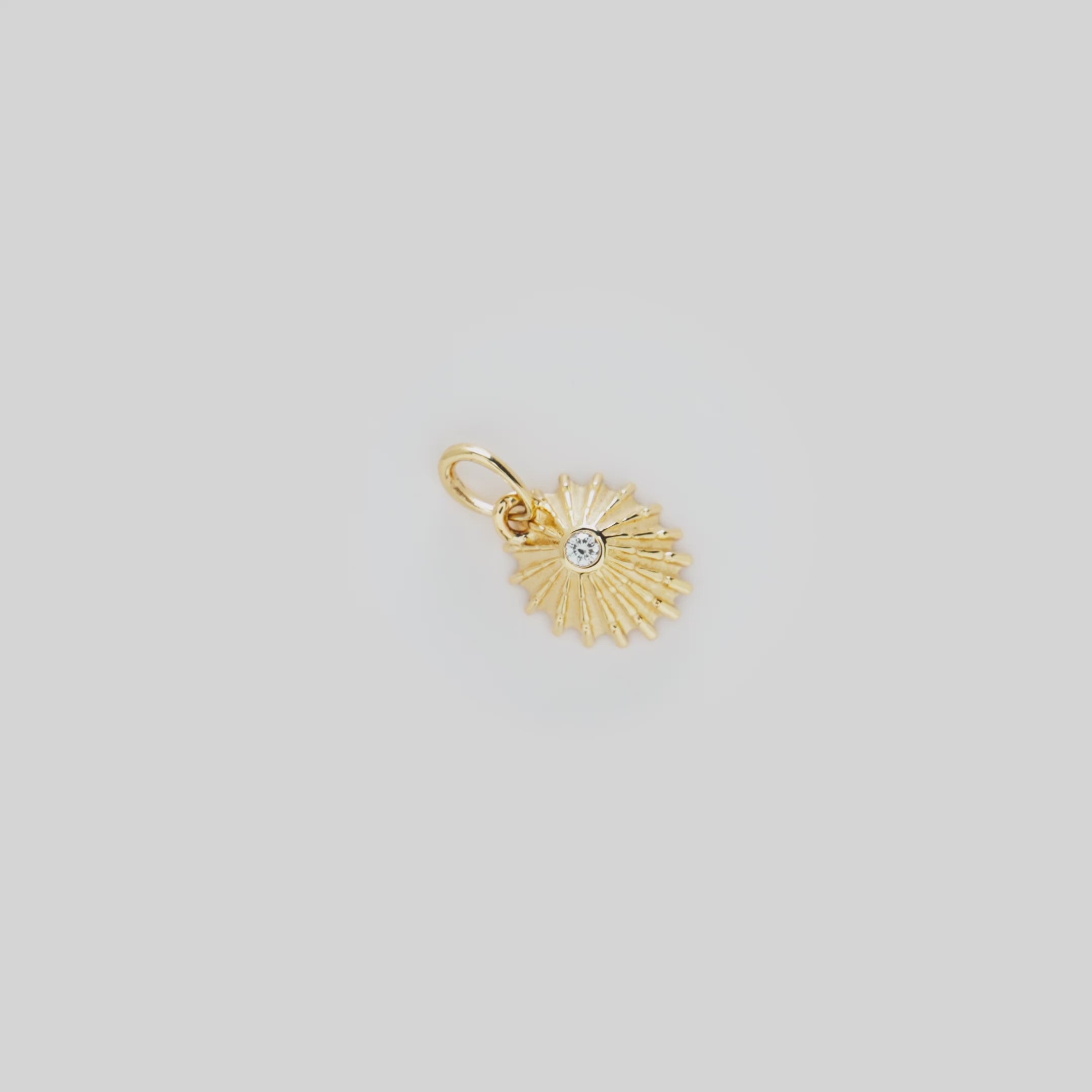 Video showcasing the ʻOpihi Pendant in 14k Yellow Gold with Diamond on a turn table
