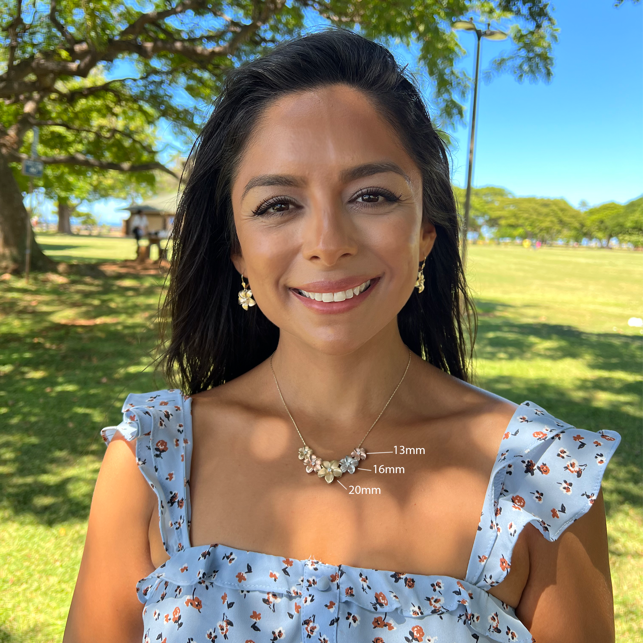 A woman wearing three sizes of Plumeria Pendant in White Gold with Diamond - 16mm-Maui Divers Jewelry